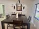 Dining room with a dark wood table and decorative accents at 341 N Fork Dr, Lakeland, FL 33809