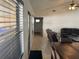 Living room with brown leather furniture and wooden table at 341 N Fork Dr, Lakeland, FL 33809