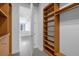 Walk-in closet with open shelving and hanging space, leading into the apartment at 150 E Robinson St # 221, Orlando, FL 32801