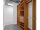 Walk-in closet with extensive shelving and drawers for optimal storage solutions at 150 E Robinson St # 221, Orlando, FL 32801