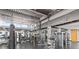 Fully equipped gym with modern weight machines, mirrors, exposed ductwork and beams, and abundant natural light at 150 E Robinson St # 221, Orlando, FL 32801