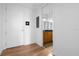 Hallway leading into the bathroom featuring hardwood floors, vanity and storage at 150 E Robinson St # 221, Orlando, FL 32801