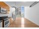 Open floorplan featuring spiral staircase, hardwood floors, and ample natural light from large windows at 150 E Robinson St # 221, Orlando, FL 32801