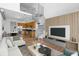 Open-concept living area with hardwood floors, spiral staircase, and modern decor, offering a stylish ambiance at 150 E Robinson St # 221, Orlando, FL 32801