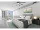 Well-lit bedroom featuring a large bed, ceiling fan, modern decor, and a view at 150 E Robinson St # 221, Orlando, FL 32801