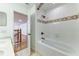 Bathroom with shower/tub combo and view of upper floor at 2804 Polson Dr, Kissimmee, FL 34758