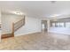 Foyer with tile flooring and a staircase with an iron railing at 2804 Polson Dr, Kissimmee, FL 34758