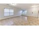 Foyer with tile flooring and a staircase with an iron railing at 2804 Polson Dr, Kissimmee, FL 34758