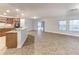 Open floor plan, kitchen island, stainless steel appliances, and tile floors at 2804 Polson Dr, Kissimmee, FL 34758