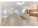 Open floor plan, kitchen island, and tile flooring throughout at 2804 Polson Dr, Kissimmee, FL 34758