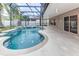 Relaxing pool and spa area with a screened enclosure at 2804 Polson Dr, Kissimmee, FL 34758