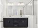 Bathroom features double sinks, a large mirror, and a glass-enclosed shower at 520 Astera Winds Ln, Lake Mary, FL 32746