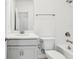 Well-lit bathroom featuring a tub, shower, and single sink vanity at 520 Astera Winds Ln, Lake Mary, FL 32746