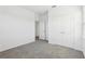 Carpeted bedroom featuring a closet, window, and neutral color palette at 520 Astera Winds Ln, Lake Mary, FL 32746