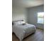 Bright bedroom with water view and light pink bed frame at 13467 Panama Beach Ct, Orlando, FL 32827