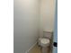 This powder room features a toilet and a waste bin at 13467 Panama Beach Ct, Orlando, FL 32827