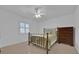 Spacious bedroom with double bed and ceiling fan at 509 E Lakeshore Dr, Ocoee, FL 34761