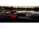 Private boat dock with covered area and red lighting at night at 509 E Lakeshore Dr, Ocoee, FL 34761