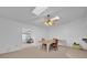 Dining room with a skylight and a view into the living room at 509 E Lakeshore Dr, Ocoee, FL 34761