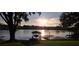 Tranquil sunset over calm lake at 509 E Lakeshore Dr, Ocoee, FL 34761