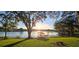 Sunrise view of lake and private dock at 509 E Lakeshore Dr, Ocoee, FL 34761