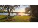 Scenic sunset over lake with private dock at 509 E Lakeshore Dr, Ocoee, FL 34761