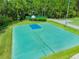 Well-maintained basketball court providing a great recreational space for residents at 2024 Capri Ln, Mount Dora, FL 32757