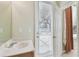 Bright bathroom with a sink, a door with exterior access, and natural light at 2024 Capri Ln, Mount Dora, FL 32757