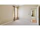 Bedroom with carpet, neutral paint, window, and an open door leading to another room at 2024 Capri Ln, Mount Dora, FL 32757