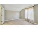 Empty bedroom showcasing vaulted ceilings, light walls, wood floors and a window with sheer curtains at 2024 Capri Ln, Mount Dora, FL 32757