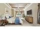 Bedroom featuring a large bed, bay windows with view, and ample natural light at 2024 Capri Ln, Mount Dora, FL 32757