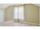 Bright, airy bedroom featuring wood floors, light walls and a large window with sheer curtains at 2024 Capri Ln, Mount Dora, FL 32757