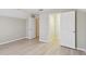 A spacious bedroom with wood floors, and access to a closet and other rooms at 2024 Capri Ln, Mount Dora, FL 32757