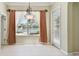 Inviting dining area featuring tile flooring and natural light at 2024 Capri Ln, Mount Dora, FL 32757