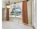 Bright dining area overlooking the lake and patio area at 2024 Capri Ln, Mount Dora, FL 32757