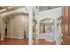 Grand foyer showcasing archways, soaring ceilings, and natural light from the lake beyond at 2024 Capri Ln, Mount Dora, FL 32757