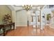 Elegant entryway with hardwood floors, archways, and decorative console table at 2024 Capri Ln, Mount Dora, FL 32757