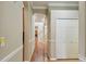 Hallway featuring hardwood floors and arched doorways at 2024 Capri Ln, Mount Dora, FL 32757