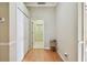 Hallway with light wood floors and access to rooms at 2024 Capri Ln, Mount Dora, FL 32757