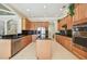 Spacious kitchen with stainless steel appliances, granite countertops, and a center island at 2024 Capri Ln, Mount Dora, FL 32757