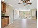 Open living area with wood-look floors, chandelier, staircase, and view of upstairs landing at 2024 Capri Ln, Mount Dora, FL 32757