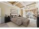 This main bedroom boasts a trey ceiling, neutral colors, soft carpet, and lots of natural light at 2024 Capri Ln, Mount Dora, FL 32757