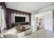 Media room with comfortable seating and large TV at 2024 Capri Ln, Mount Dora, FL 32757
