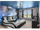 Spacious bedroom with king-size bed and space mural at 7614 Oak Spring Ln, Davenport, FL 33837