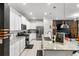 Modern kitchen with stainless steel appliances and granite countertops at 7614 Oak Spring Ln, Davenport, FL 33837