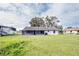 House with screened patio and large backyard at 7631 Lewis Rd, Lakeland, FL 33810