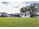 House with screened patio and large backyard at 7631 Lewis Rd, Lakeland, FL 33810