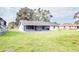 House with screened patio and large backyard at 7631 Lewis Rd, Lakeland, FL 33810