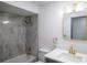 Bathroom featuring tile surround shower, gold fixtures, and a modern vanity with countertop at 7631 Lewis Rd, Lakeland, FL 33810