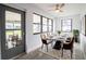 Dining room featuring a modern table set and a door to the outdoor porch at 7631 Lewis Rd, Lakeland, FL 33810
